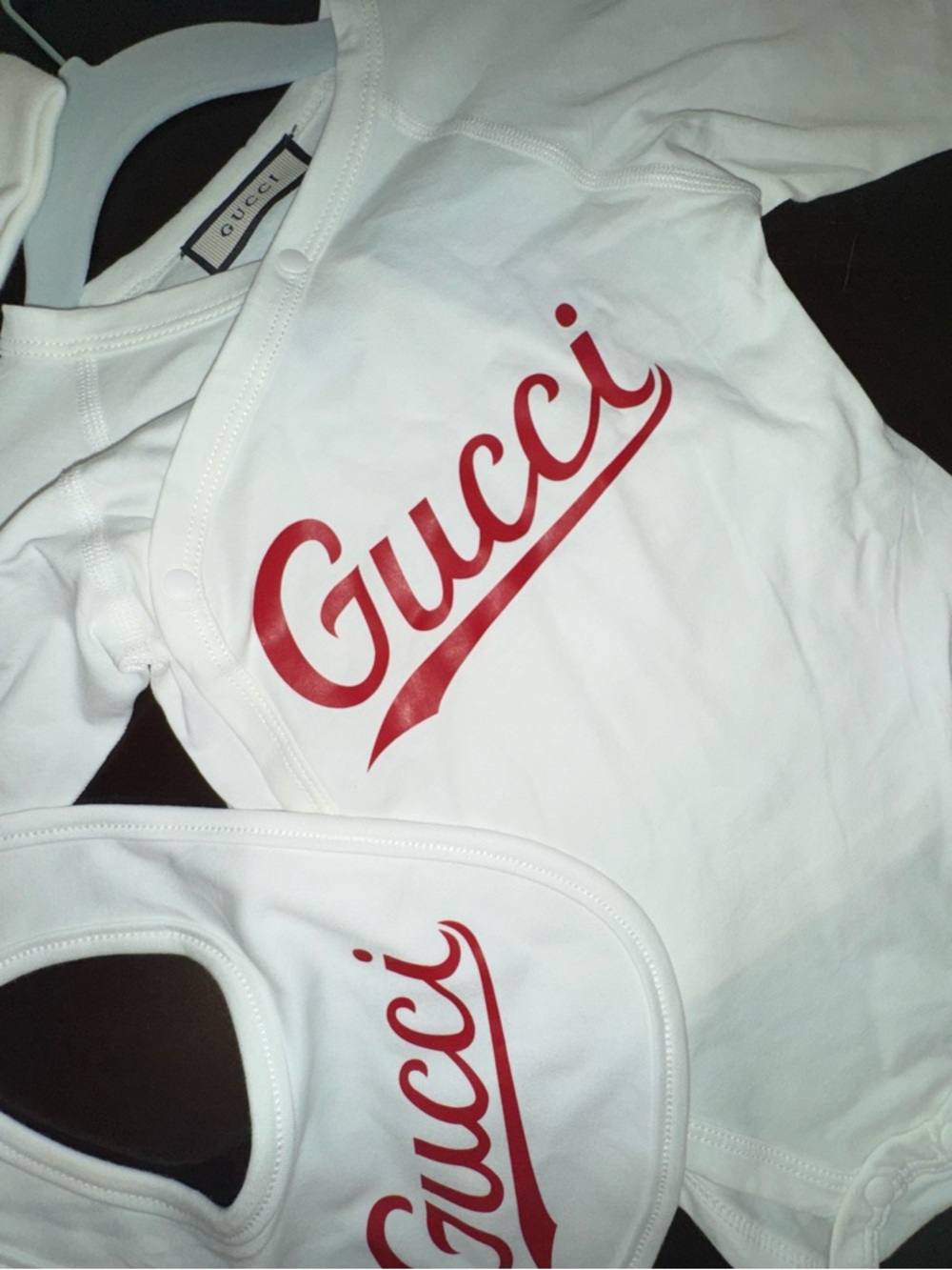 Gucci Kids White Bodysuit, bib, and hat with Red Logo